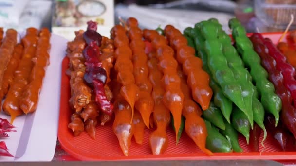 Multicolored Churchkhela is Sold on Open Stall, Showcase, Shelving in Market — 图库视频影像
