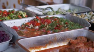 Sale of Ready Mayonnaise Vegetable Salads in Containers on an Open Counter. Zoom