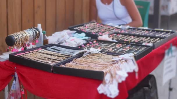 Gold Rings, Necklaces, Chains, Bracelets are Sold on the Open Counter. Close up — стоковое видео