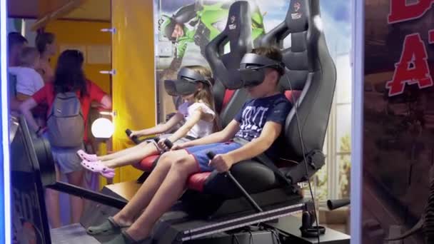 Two Children are looks a 3D Movie in Virtual Reality Glasses with Special Effect — Vídeo de Stock