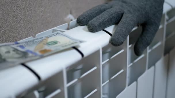 A Female in Woolen Gloves Warms Hands on a Battery at Home in a Room. Zoom — Video Stock