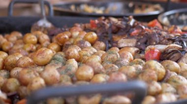 Lots of Grilled Vegetables, Young Potatoes Lie in a Large Skillet for Sale. Zoom