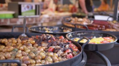 Ready Juicy Grilled Vegetables in a Large Skillet for Sale on Open Counter