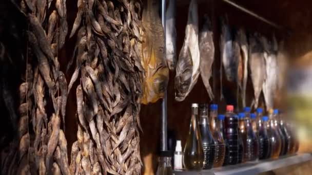 Dried Small Fish Hanging on Hooks Hang on the Open Stalls of the Street Market — Vídeo de stock