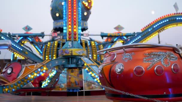 Stopped Empty Carousel Octopus on a Playground with Flickering Lights. Close up — Stock Video