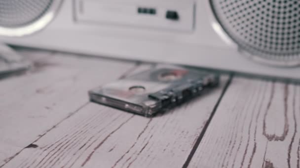 Female Hands Throwing a Lots Old Audio Cassettes on Table. Zoom. Close up — Stock Video