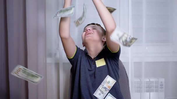 Happy Teenager Catching with Hands Falling 100 Dollar Bills Flying on his Head — Video