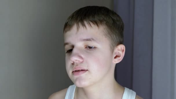 Close-up of a Face Profile of Talking Smiling Teenager Looking Down. Side View — стоковое видео