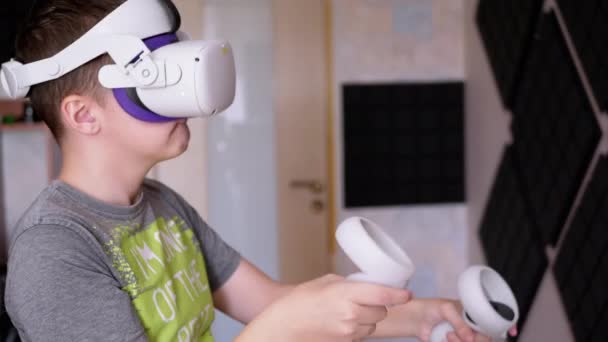 Teenager Glasses Game Controllers Plays Soundproof Room Boy White Helmet — Stock Video
