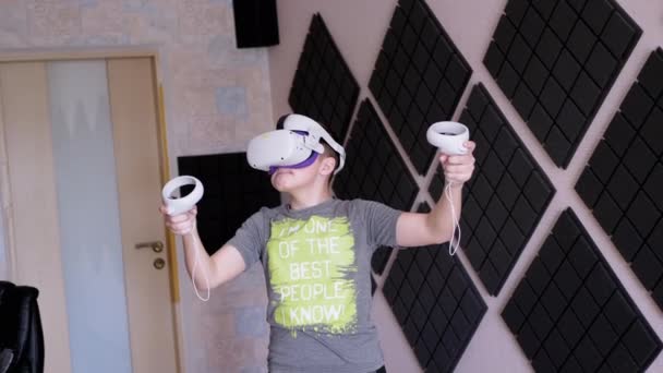 Teenager Glasses Game Controllers Plays Soundproof Room Boy White Helmet — Stock Video