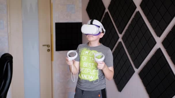 Teenager Glasses Game Controllers Plays Soundproof Room Boy White Helmet — Stock Video