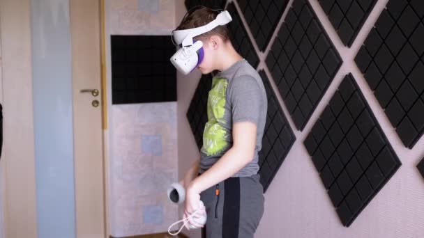 Teenager Glasses Game Controllers Plays Soundproof Room Boy White Helmet — Stock Video