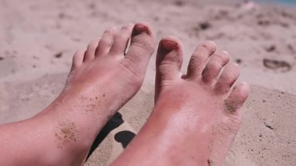 Tanned Red Bare Child Feet Sand Lies Sandy Beach Seashore — Stock Video