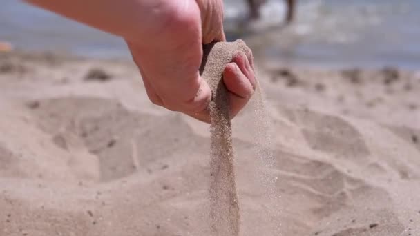 Female Hand Pours Sand Fingers Beach Rays Sunlight Fine Grains — Stockvideo