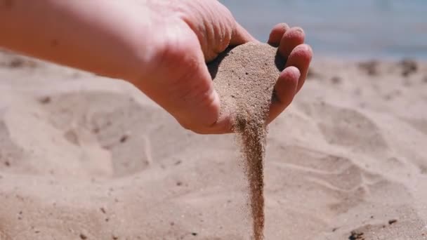 Female Hand Pours Sand Fingers Beach Rays Sunlight Fine Grains — Stockvideo