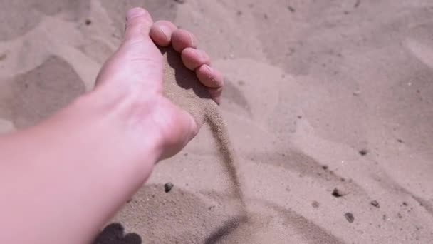 Female Hand Pours Sand Fingers Beach Rays Sunlight Fine Grains — Stock Video