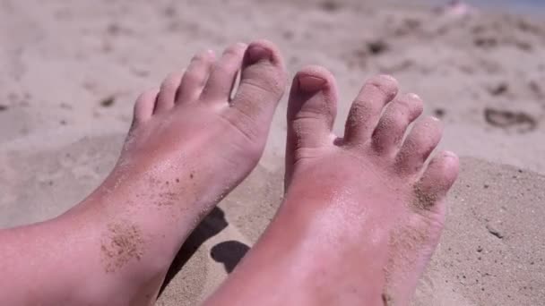 Tanned Red Bare Child Feet Sand Lies Sandy Beach Seashore — Stock Video