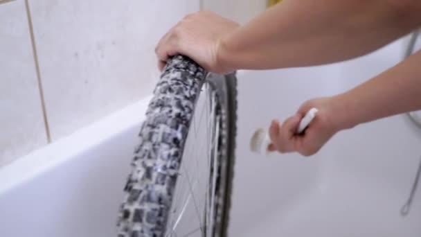 Male Hands Cleaning Dirty Bicycle Wheel Brush Foam Bathroom Washing — Αρχείο Βίντεο