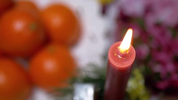 Red Candle Burning Bright Flame Background Christmas Table View Table — Stock video