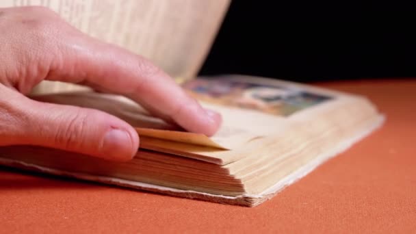 Female Fingers Leafing Pages Old Shabby Book Black Background Reading — Stockvideo