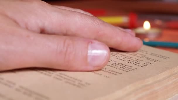 Woman Reading Book Candlelight Dark Room Follows Text Finger Close — Stok video