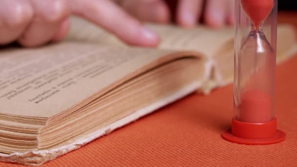 Woman Reading Book Candlelight Dark Room Follows Text Finger Close — Stock video