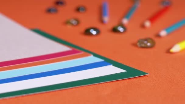 Female Hands Laying Multicolored Sheets Cardboard Orange Background Preparation Colored — Stock videók