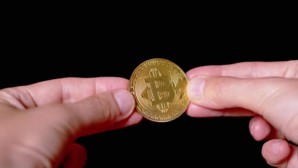 Businessman Hands Holding One Gold Bitcoin Coin Isolated Black Background — ストック動画