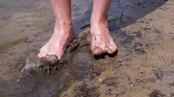 Male Feet Splashing Mud Dirty Water Standing River Bank Sun — ストック動画