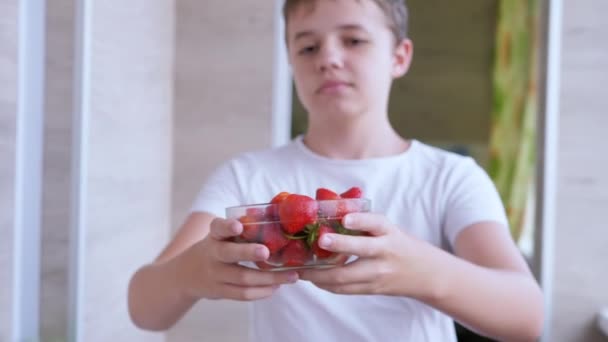 Child Holding Hands Full Glass Bowl Red Strawberry Sunlight Room — Vídeo de stock