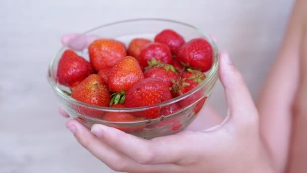 Child Holding Hands Full Glass Bowl Red Strawberry Sunlight Room — 图库视频影像