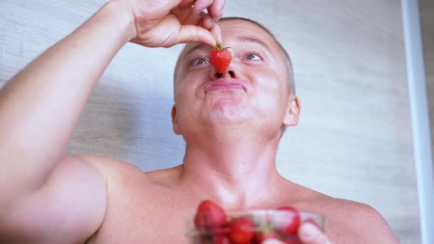 Joyful Laughing Male Sniffing Smelling Strawberry His Nose Room Smiling — Stok Video