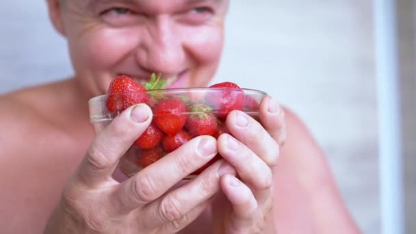 Joyful Laughing Male Sniffing Smelling Strawberry His Nose Room Smiling — Stok Video