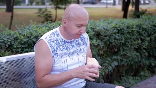 Hungry Male Resting Bench Eating Shawarma Bread Outdoors Park Street — Wideo stockowe