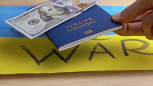 Рука Ставит Биометрический Паспорт Украины Наличными Фоне Флага Рисование Желтого — стоковое видео