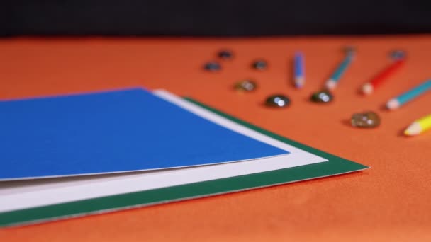 Female Hands Laying Multicolored Sheets Cardboard Orange Background Preparation Colored — Stock Video