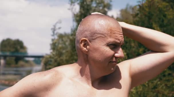 Pensive Bald Male Thinks Dreams Nature Stroking Head Hand Outdoors — Stok Video