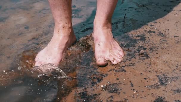 Male Feet Splashing Mud Dirty Water Standing River Bank Sun — Αρχείο Βίντεο