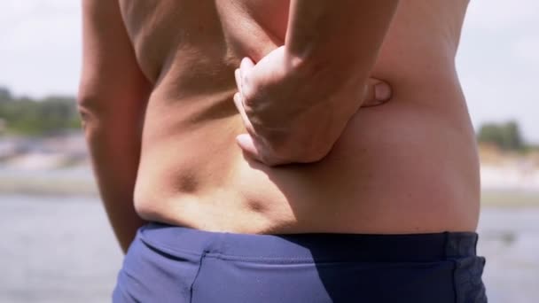 Resting Male Nature Rubs His Back Lower Back Spine Hand — 图库视频影像