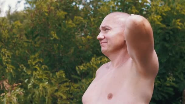 Pensive Bald Male Thinks Dreams Nature Stroking Head Hand Outdoors — Stock Video