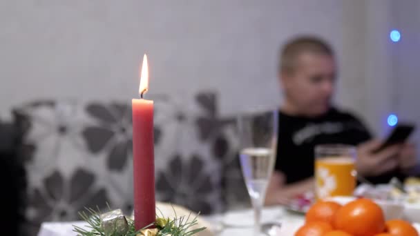 Burning Red Christmas Candle Burns Bright Flame New Years Table — Stock videók