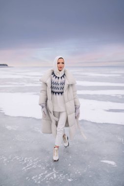 young woman posing  at winter time