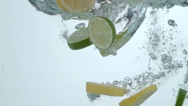 Lemon Lime Slices Splashing Water Slow Motion — Stock Video