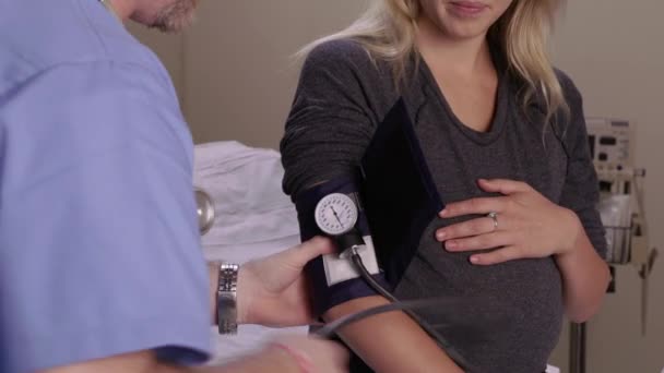 Pregnant Woman Has Blood Pressure Taken — Stock Video