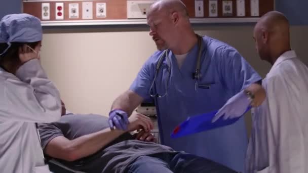 Emergency Room Doctors Examine Man Head Injury — Stock Video