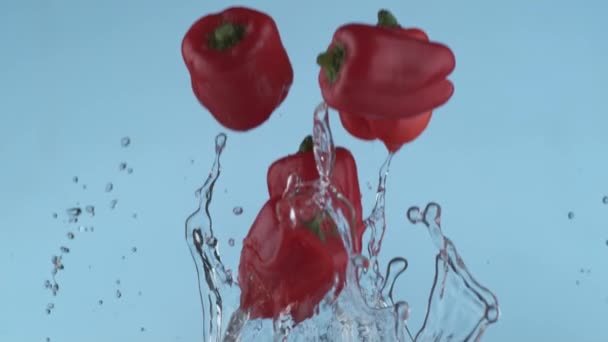 Pimientos Rojos Volando Cámara Lenta Disparados Con Phantom Flex 1000 — Vídeos de Stock