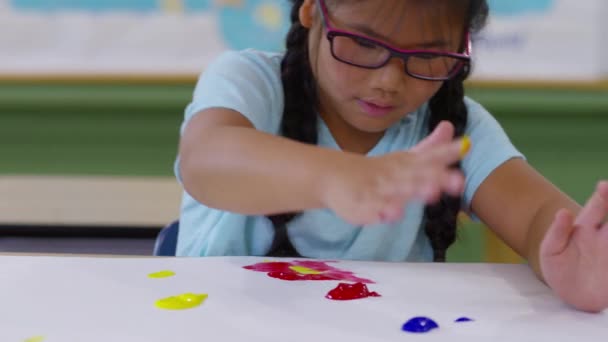 Young Girl Finger Painting — Stock Video