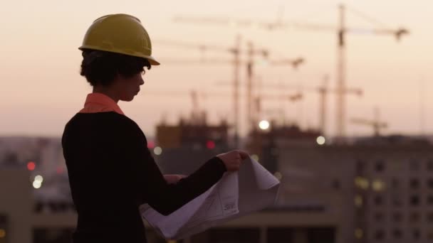 Architect Holding Plans Looking Construction Site Sunset Stock Footage