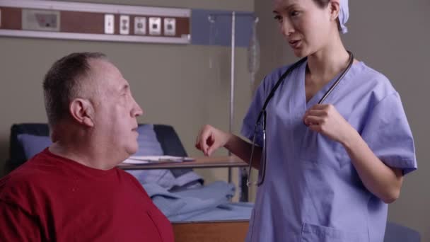 Doctor Giving Checkup Senior Man Wheel Chair — Stock Video
