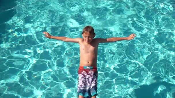 Boy Splashing Pool Slow Motion Shot Phantom Flex Stock Video